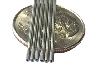 1mm od disintegrating drills sitting on a dime for comparison, diamond tools